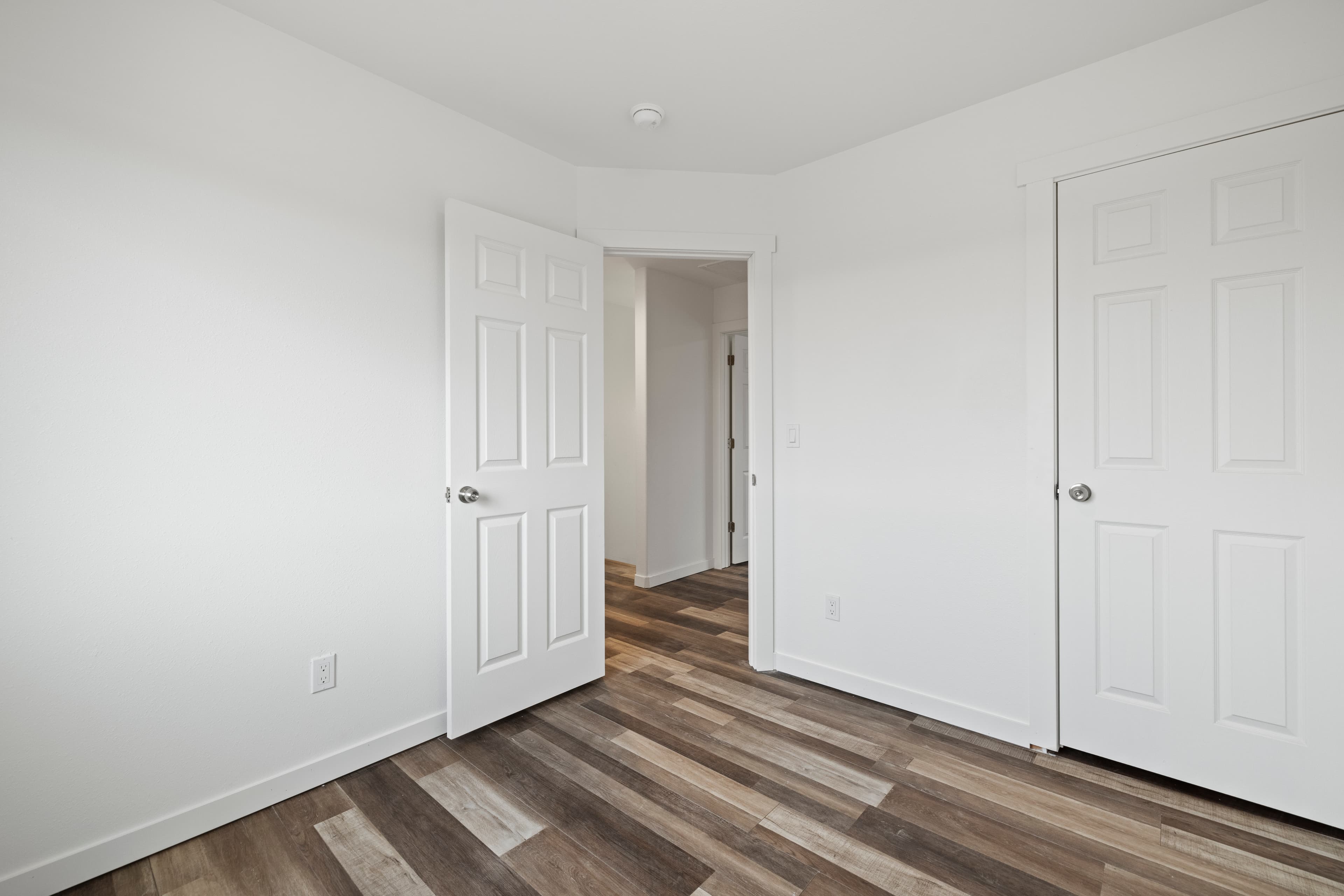 Primary bedroom inside a new-construction Marina Shore Villas townhome
