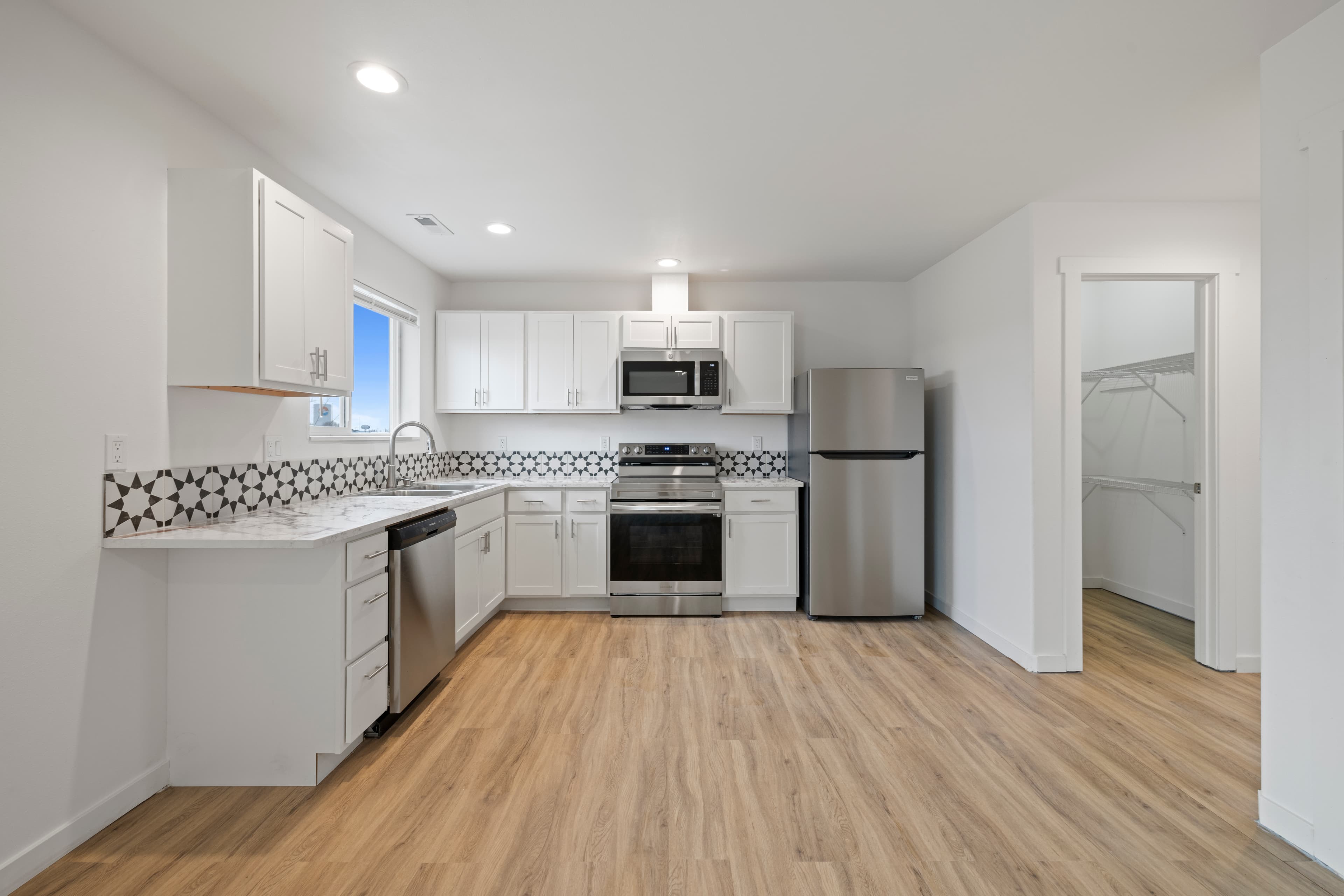 Modern kitchen with full appliance package in a Marina Shore Villas townhome